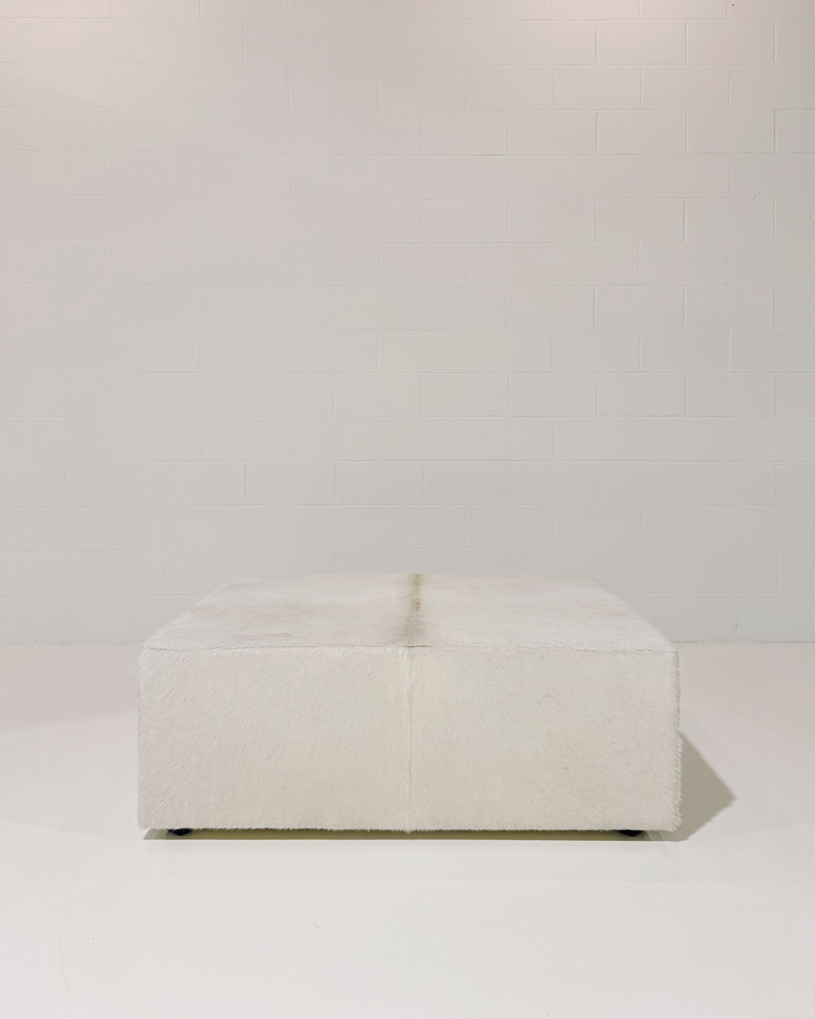 The Forsyth Large Ottoman in Cowhide